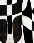 Extreme close-up of black and white wallpaper, highlighting the intricate brushstroke details and bold contrast.