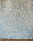Large wall drop of Opal Down the Rabbit Hole Wallpaper over a wooden interior floor