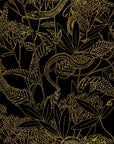 A close-up of wallpaper with a black background and gold botanical illustrations, including detailed plant life and snakes in an intricate, nature-inspired design