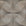 Contemporary wallpaper featuring an earthy taupe background with abstract, curved geometric shapes outlined by delicate black dot patterns, creating a textured and organic visual effect.