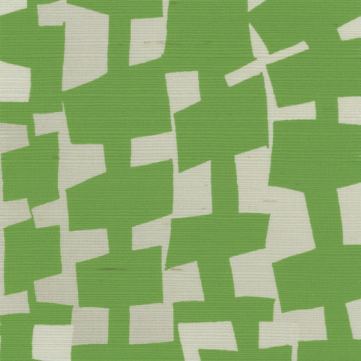 A close-up of geometric-patterned grasscloth wallpaper in vibrant green and off-white, featuring irregularly shaped blocks creating an abstract, modern design.