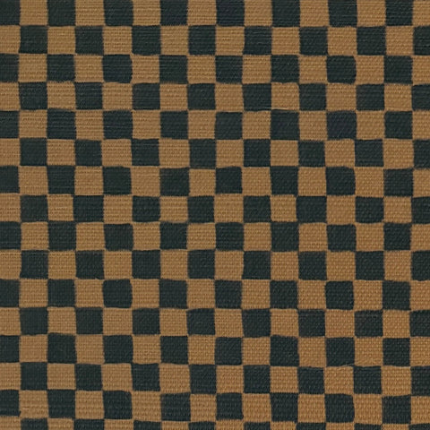 Close-up of deep brown and black checkered grasscloth wallpaper, showcasing its woven texture and subtle variations in color.