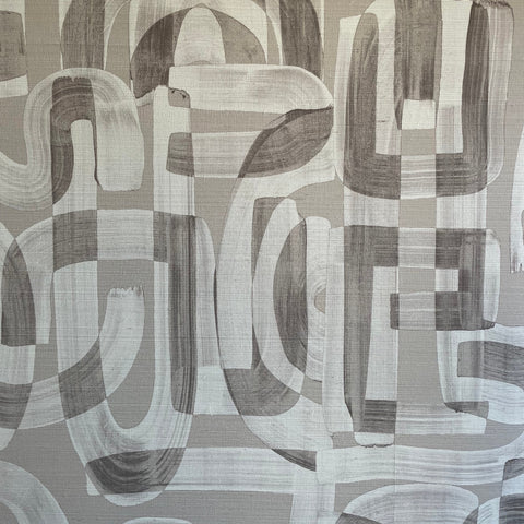 Close-up of taupe and white grasscloth wallpaper featuring an abstract brushstroke pattern with overlapping curved and geometric shapes.
