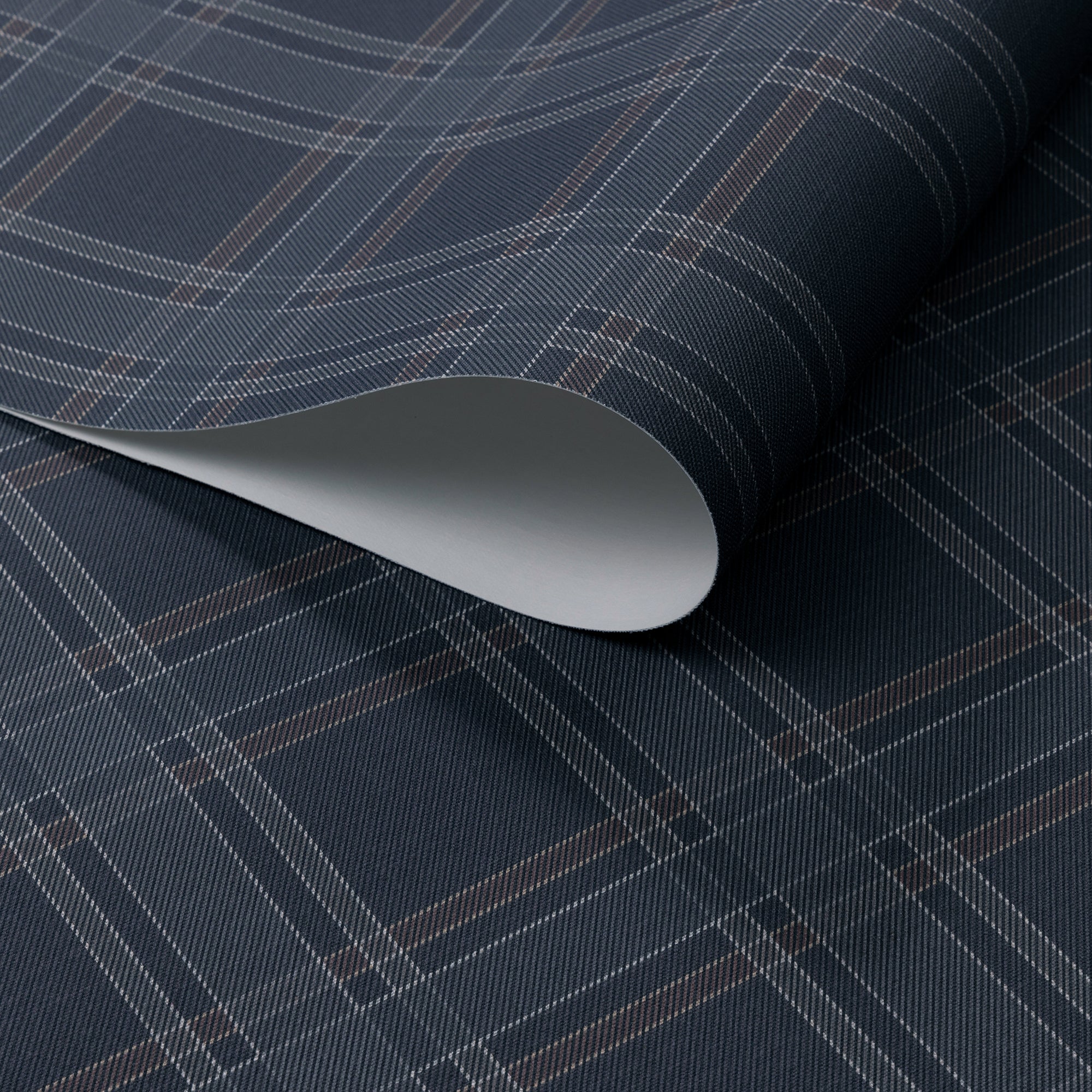 Rolled wallpaper featuring a deep charcoal base with fine plaid lines in muted brown and soft grey, styled with a subtle diagonal twill texture.