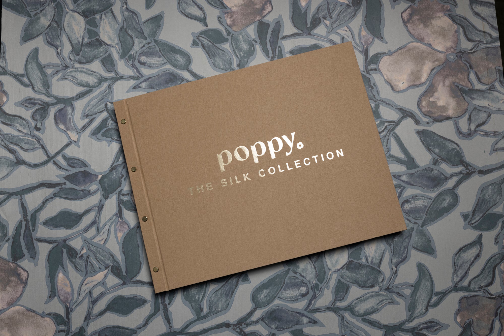 Poppy Silk Collection Sample Book Cover overlaid on wallpaper print