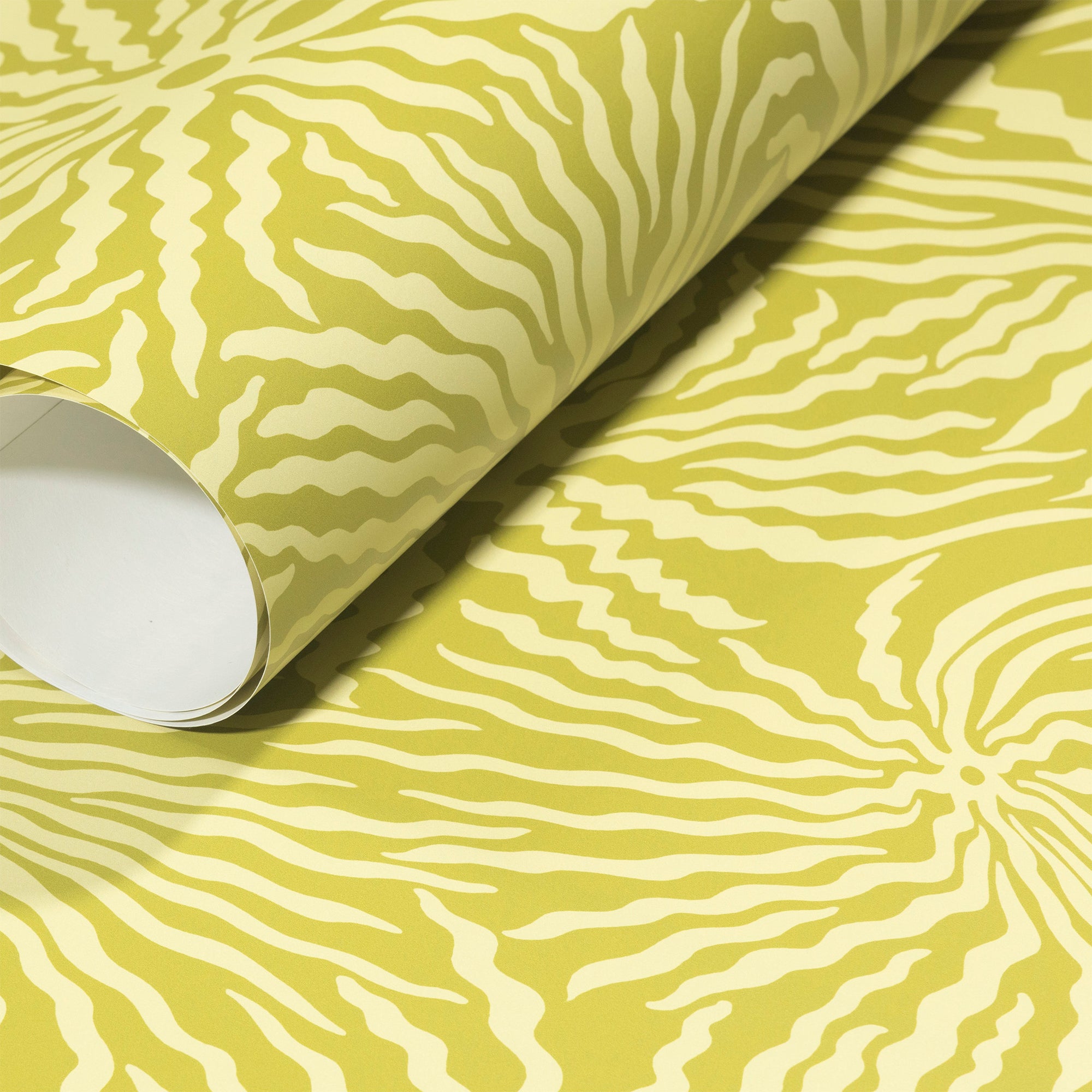Rolled-up bright green yellow wallpaper with intricate cream wave-like patterns,
highlighting its bold and energetic design.
