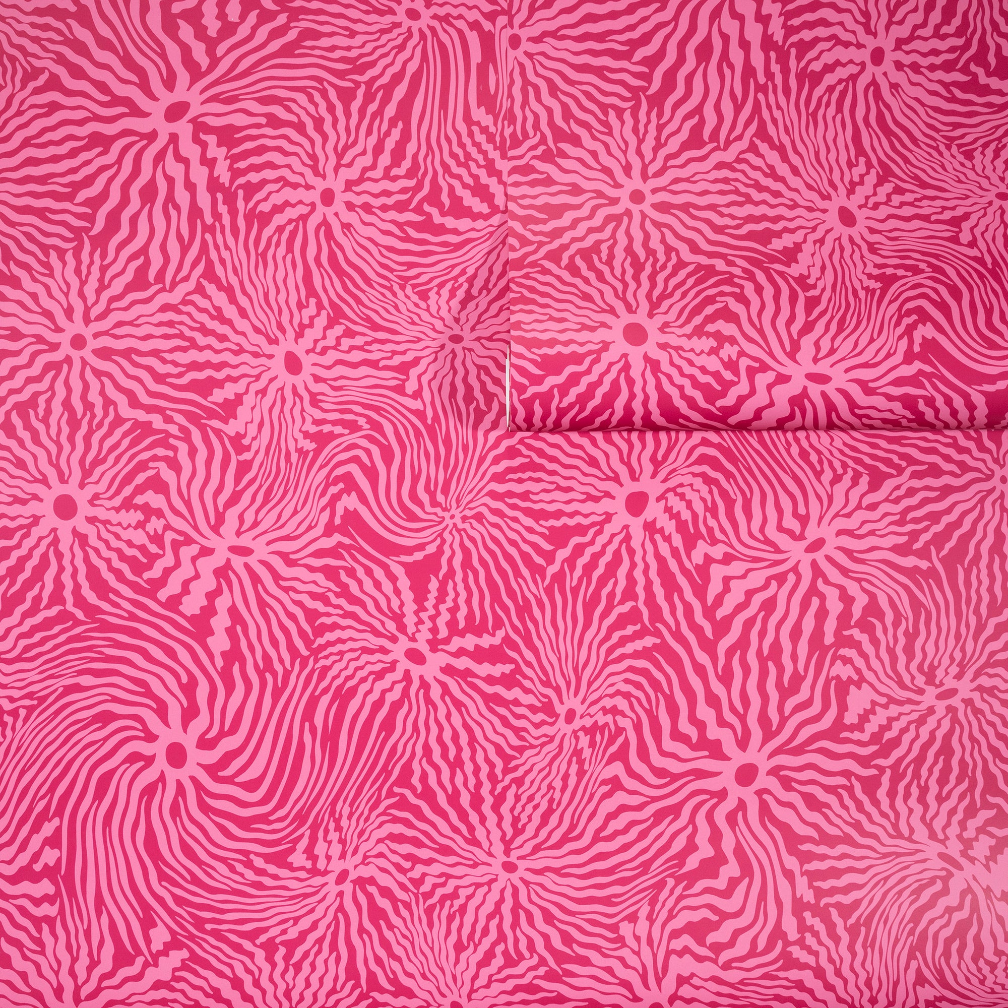 Bold pink wallpaper with swirling, wavy magenta lines radiating from circular
centers, partially unrolled to display its energetic design.