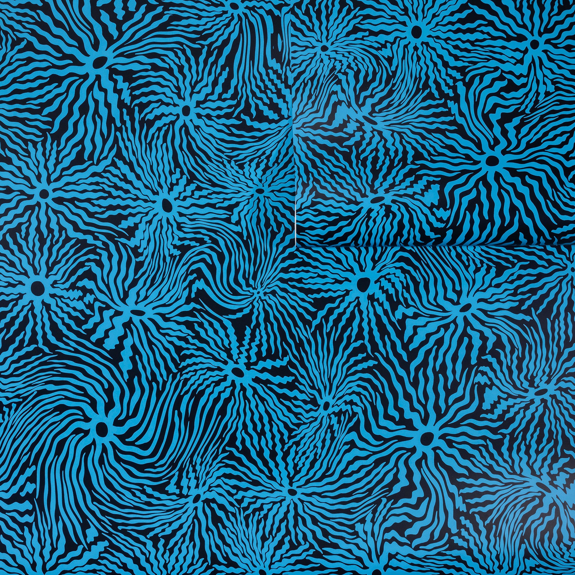 Deep navy wallpaper with electric blue swirling wavy lines radiating from circular
centers, partially unrolled to showcase the bold pattern.