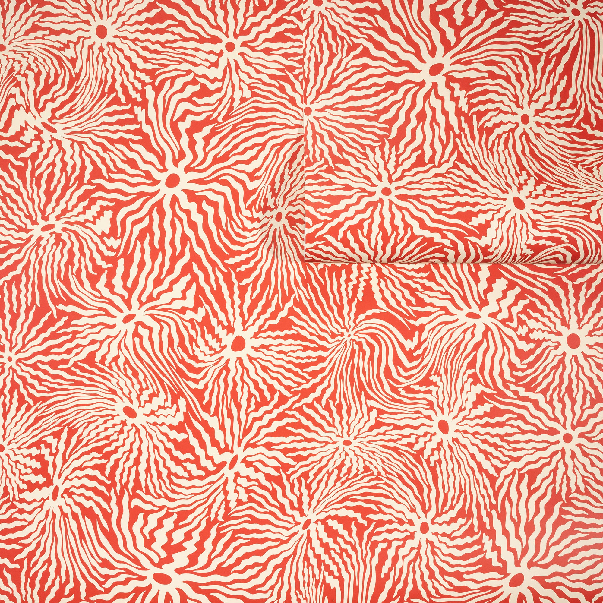 Warm terracotta wallpaper with swirling cream-colored wavy lines radiating from
circular centers, partially unrolled to display the earthy and artistic design.