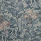 Full view of a silk wallpaper with a detailed floral and leafy pattern in muted blue tones on a soft grayish-blue background, creating a painterly effect.