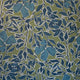 Vibrant silk wallpaper with a rich green background, deep blue leaves, and flowers outlined in white, creating a bold, hand-painted botanical pattern.