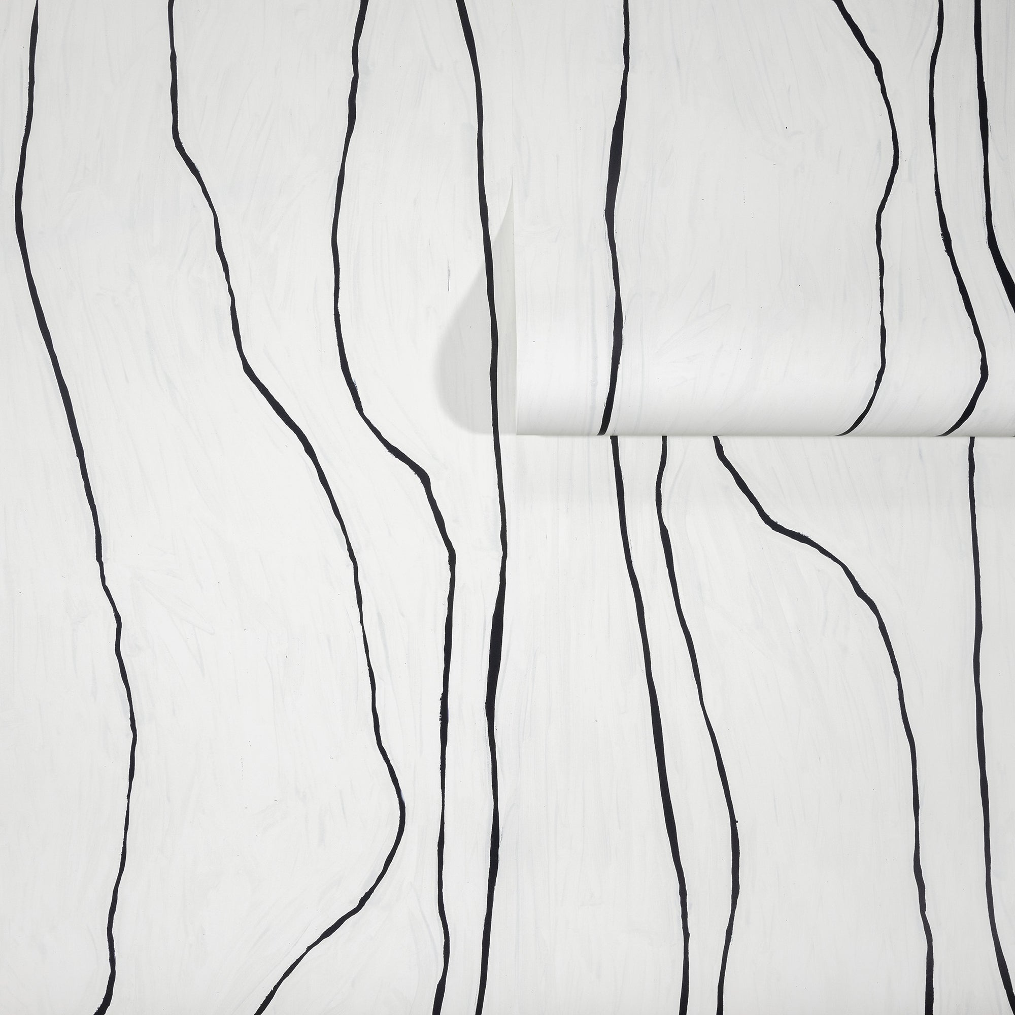 Crisp white wallpaper with bold black wavy vertical lines, partially unrolled to display the abstract pattern.