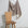 Tan and cream striped linen fabric by the yard, draped to show pattern and scale