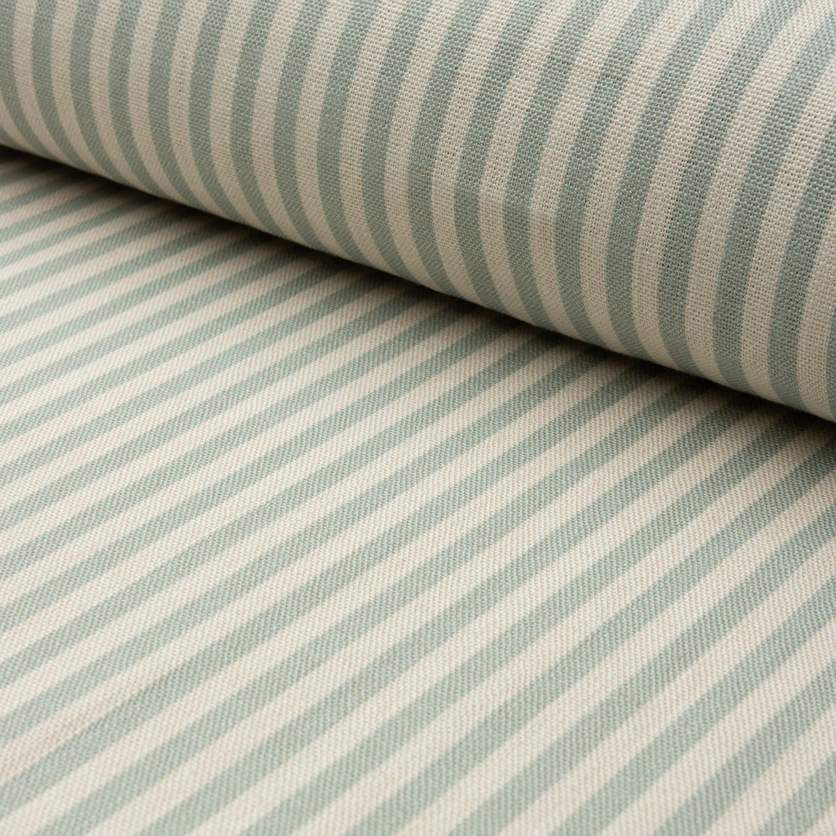 Sage green and cream striped linen fabric by the yard, rolled bolt view