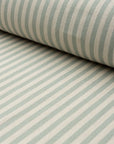 Sage green and cream striped linen fabric by the yard, rolled bolt view