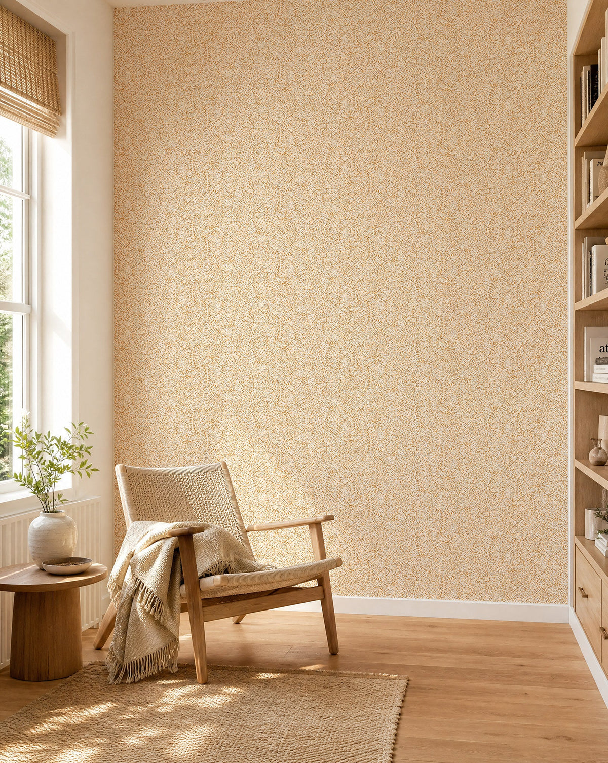 Golden yellow and cream leafy floral commercial wallcovering installed in a sunlit reading nook
