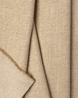 Gold herringbone outdoor fabric by the yard, folded showing drape and weight