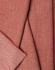 Pink herringbone outdoor fabric by the yard, folded showing drape and weight