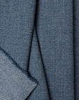 Blue herringbone outdoor fabric by the yard, folded showing drape and weight