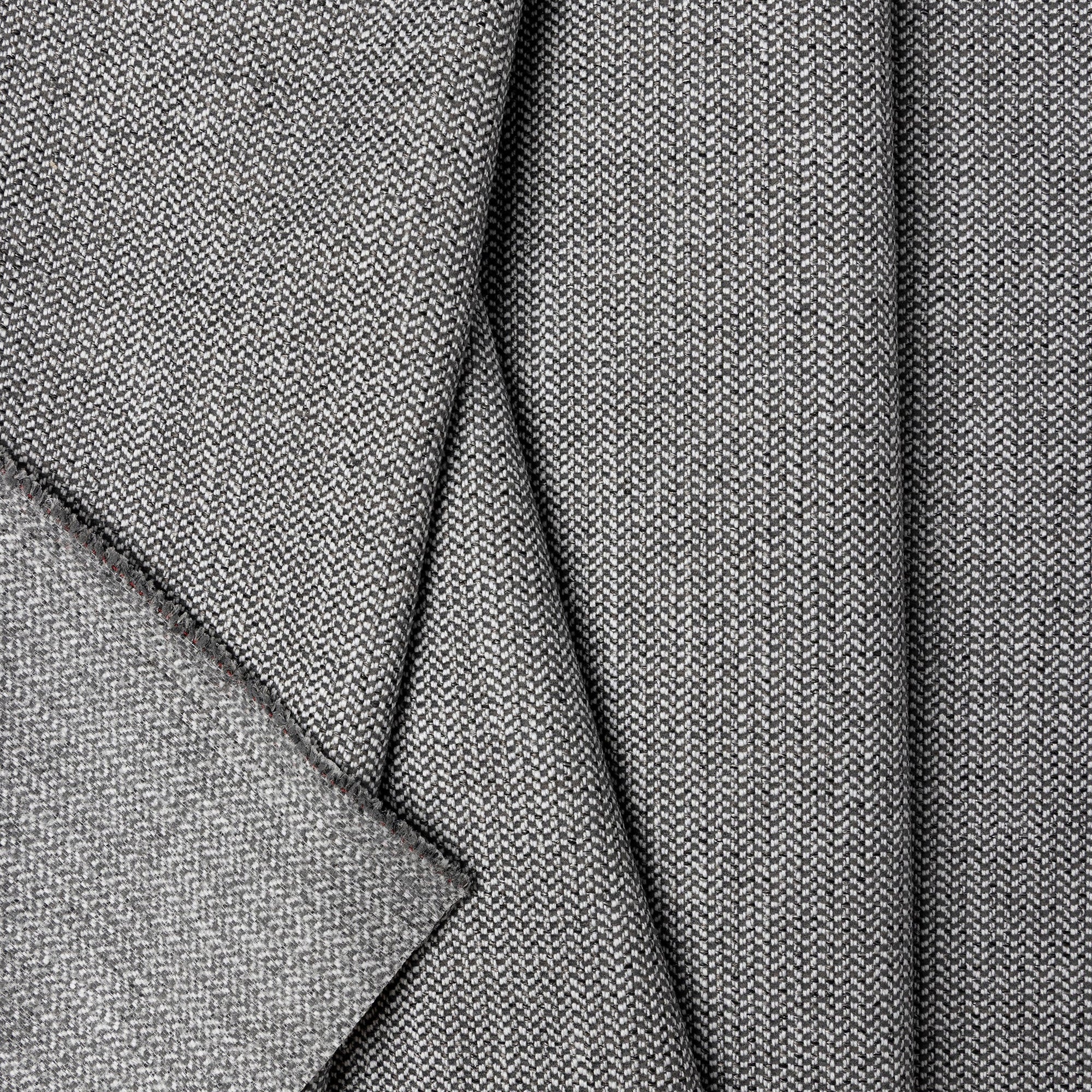 Gray herringbone outdoor fabric by the yard, folded showing drape and weight