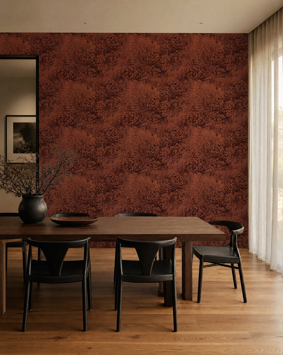 Rust red hand-sketched foliage wallpaper installed in a dining room