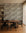 Gray and ivory hand-sketched foliage commercial wallcovering installed in a dining room