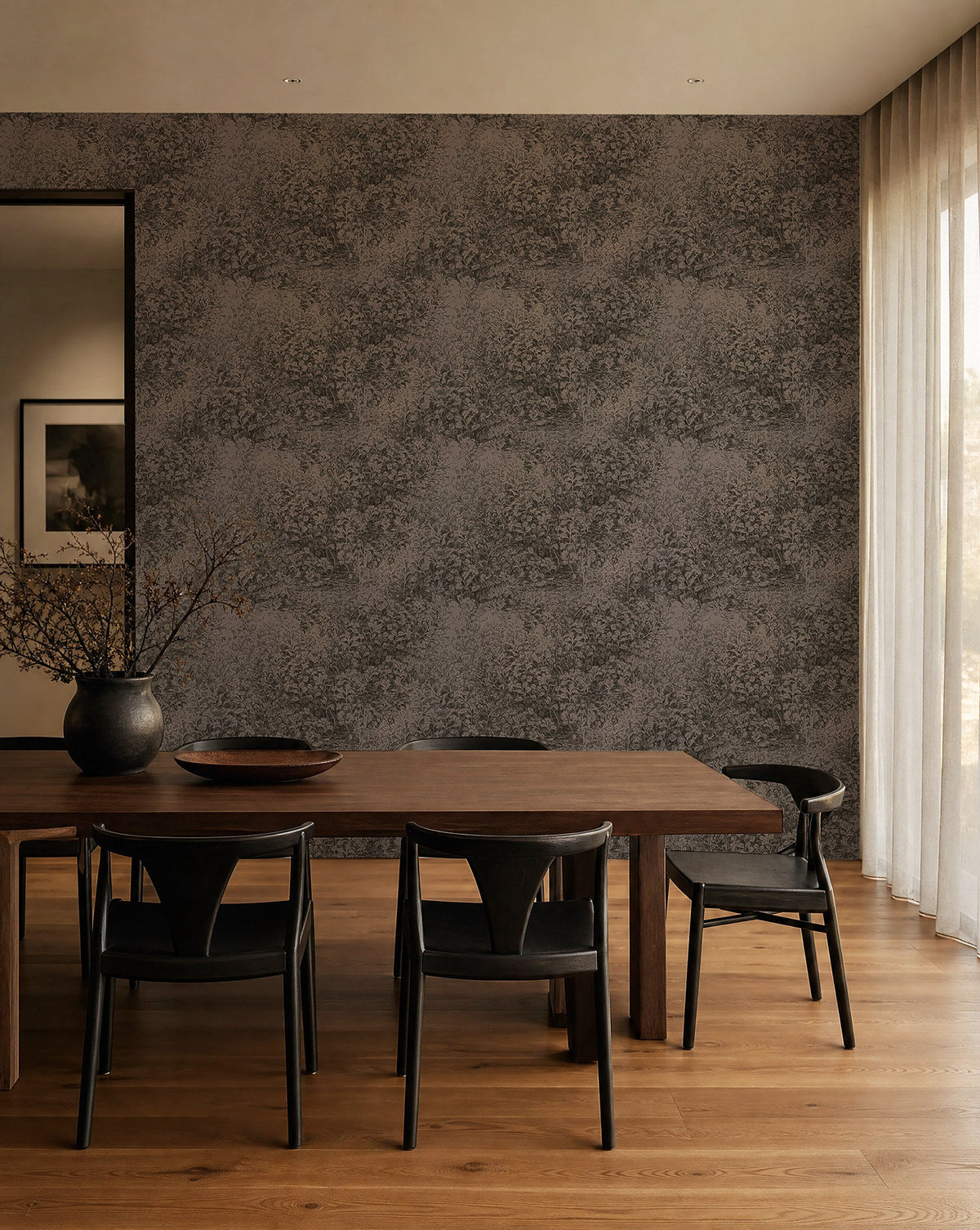 Charcoal and taupe hand-sketched foliage wallpaper installed in a dining room