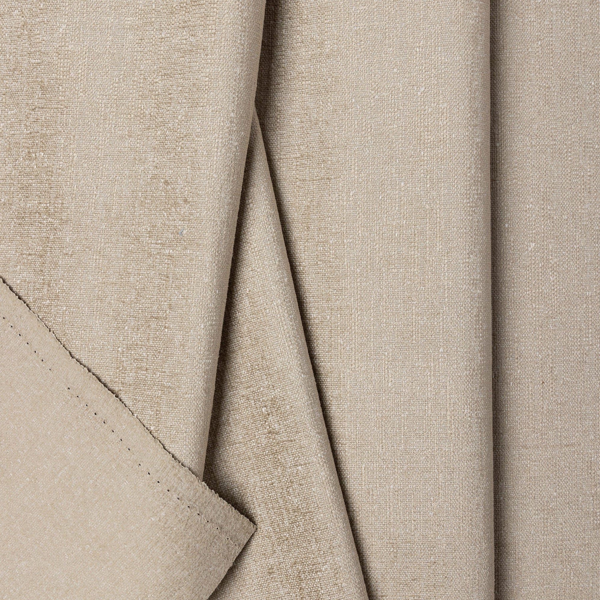 Cream chenille upholstery fabric by the yard, folded showing drape and weight