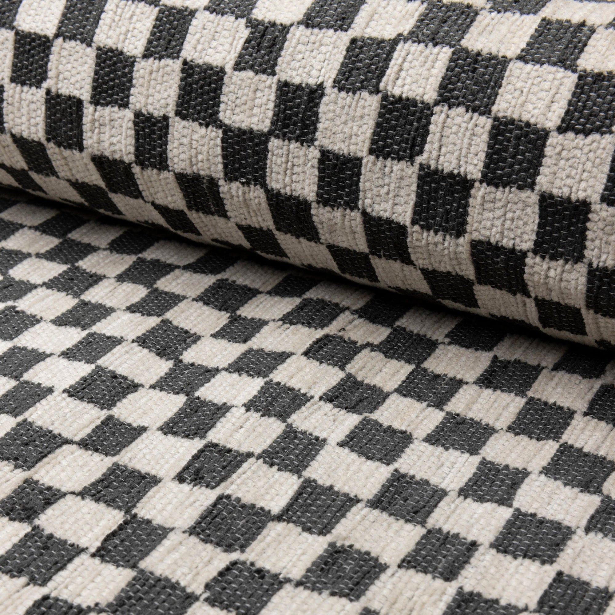 Black and ivory checkerboard jacquard upholstery fabric by the yard, rolled bolt view