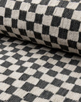 Black and ivory checkerboard jacquard upholstery fabric by the yard, rolled bolt view