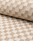 Cream and tan checkerboard jacquard upholstery fabric by the yard, rolled bolt view