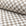 Light gray and cream checkerboard jacquard upholstery fabric by the yard, rolled bolt view