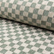 Olive green and cream checkerboard jacquard upholstery fabric by the yard, rolled bolt view