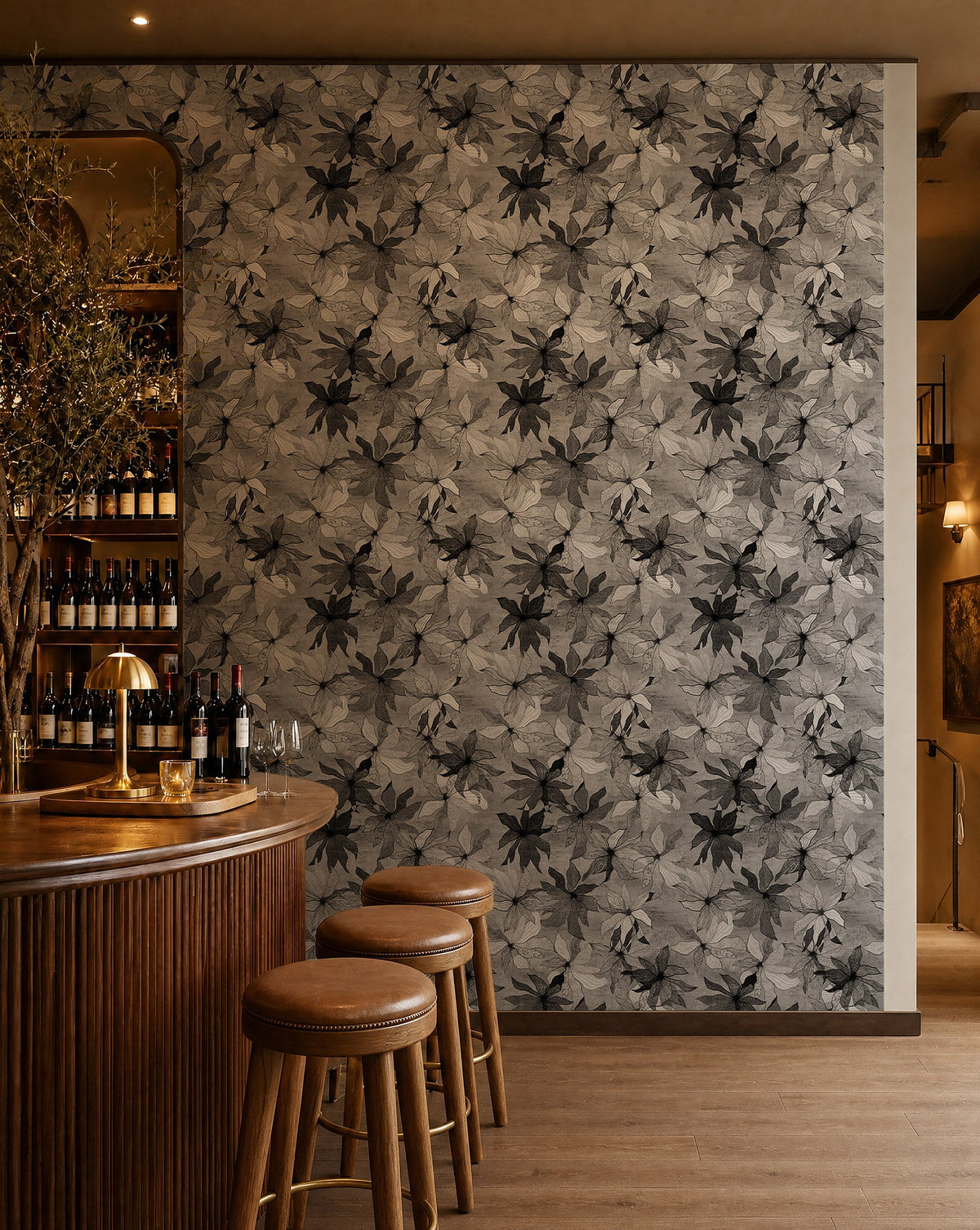 Black and white watercolor floral wallpaper installed behind a wine bar