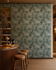 Soft teal and white watercolor floral wallpaper installed behind a wine bar