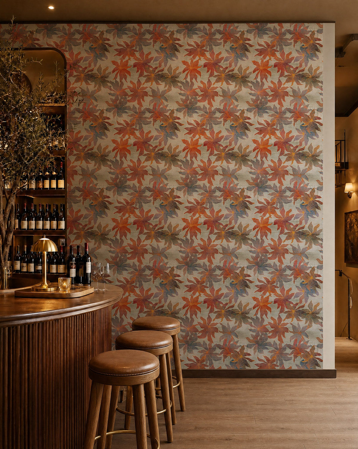 Orange and gray watercolor floral wallpaper installed behind a wine bar