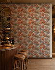 Orange and gray watercolor floral wallpaper installed behind a wine bar