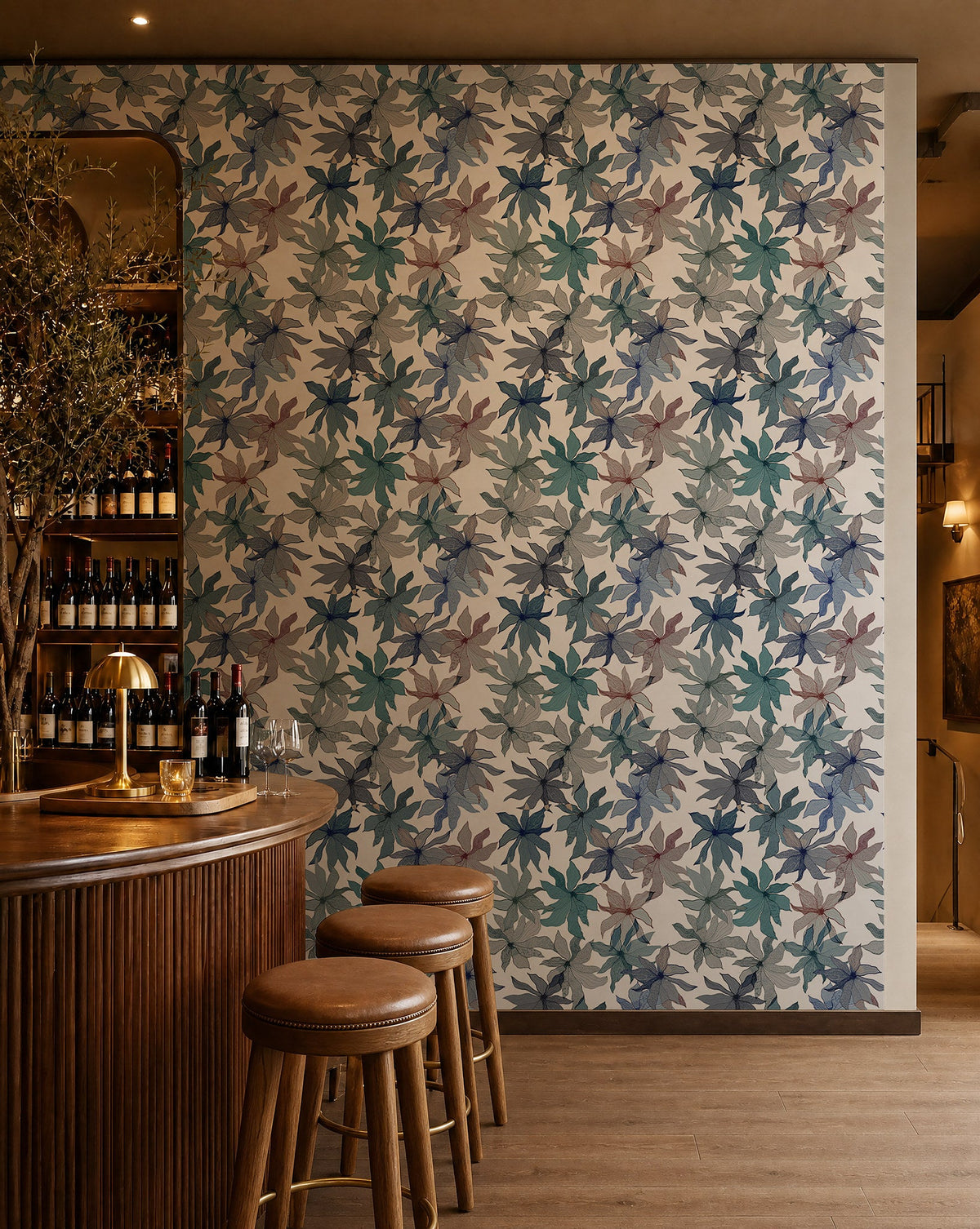 Blue watercolor floral on white wallpaper installed behind a wine bar