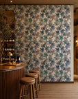 Blue watercolor floral on white wallpaper installed behind a wine bar