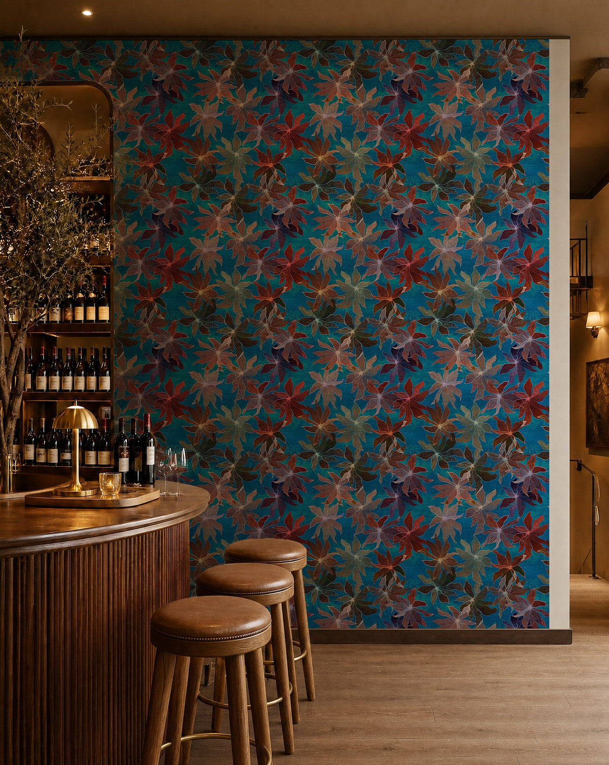 Jewel-tone floral on bright blue wallpaper installed behind a wine bar
