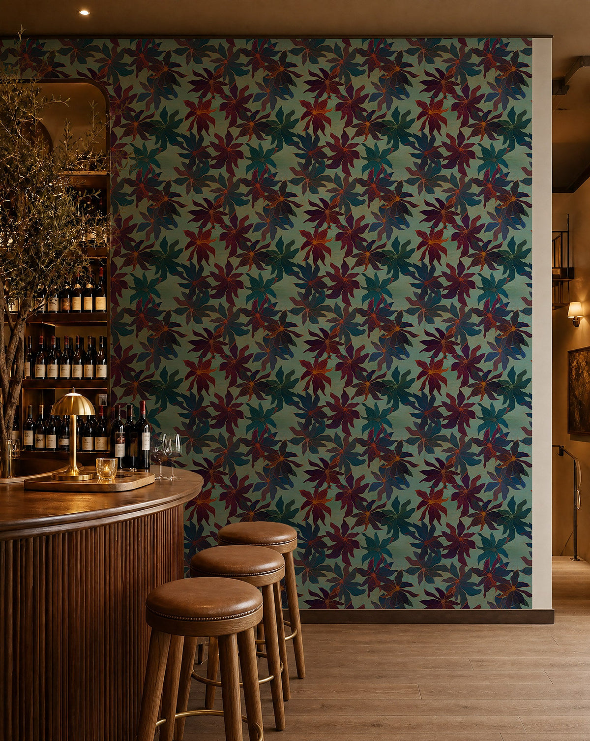 Burgundy and navy floral on teal wallpaper installed behind a wine bar