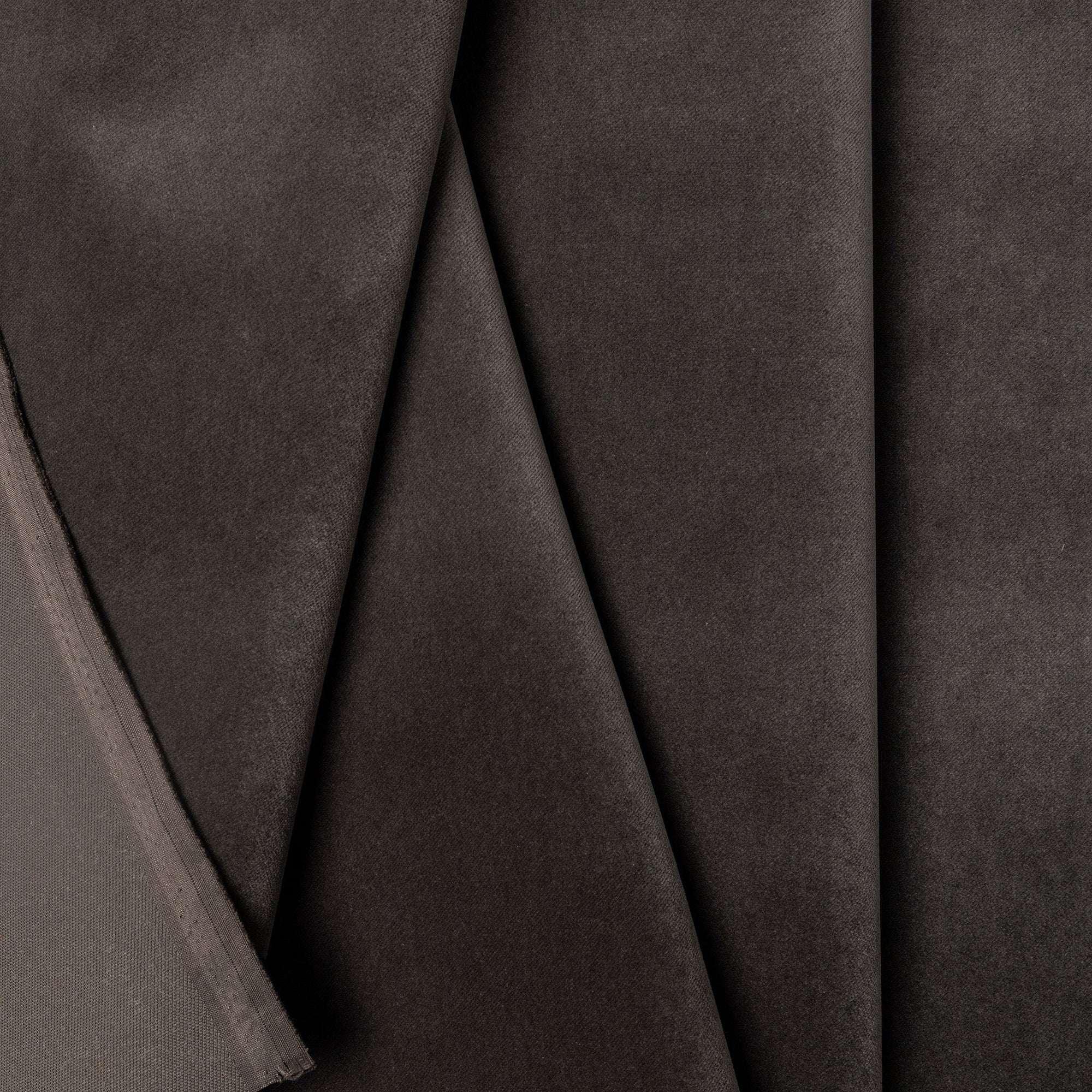 Charcoal velveteen upholstery fabric by the yard, folded showing drape and weight