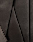 Charcoal velveteen upholstery fabric by the yard, folded showing drape and weight