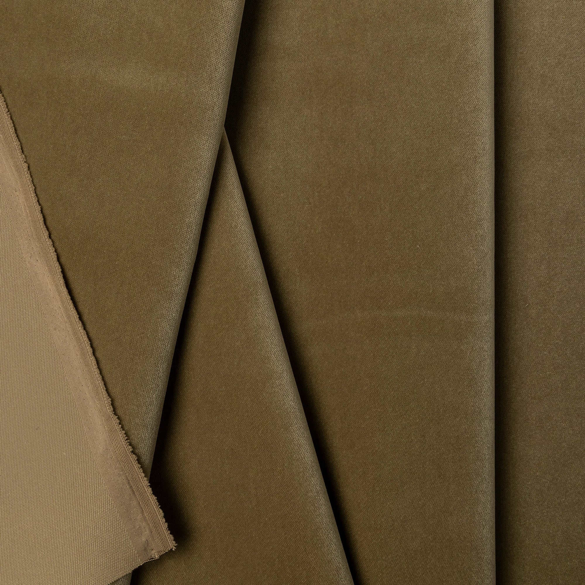 Olive green velveteen upholstery fabric by the yard, folded showing drape and weight