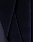 Navy velveteen upholstery fabric by the yard, folded showing drape and weight