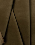 Green velveteen upholstery fabric by the yard, folded showing drape and weight