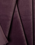 Purple velveteen upholstery fabric by the yard, folded showing drape and weight