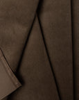 Brown velveteen upholstery fabric by the yard, folded showing drape and weight