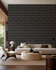 Charcoal stippled geometric wallpaper installed in a modern living room