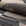 Champagne and black abstract jacquard upholstery fabric by the yard, rolled bolt view